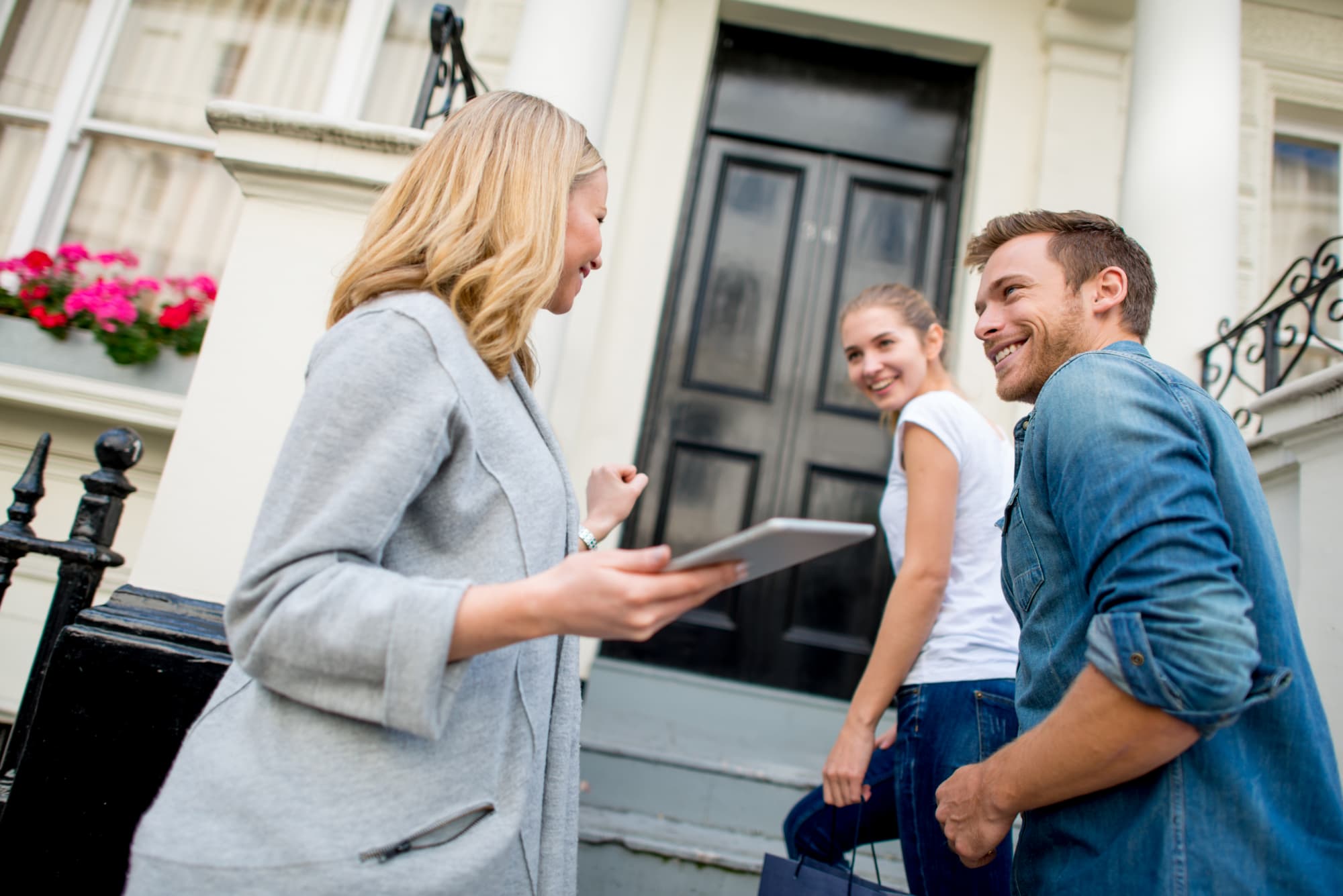 Applicants viewing a property with a real estate agent