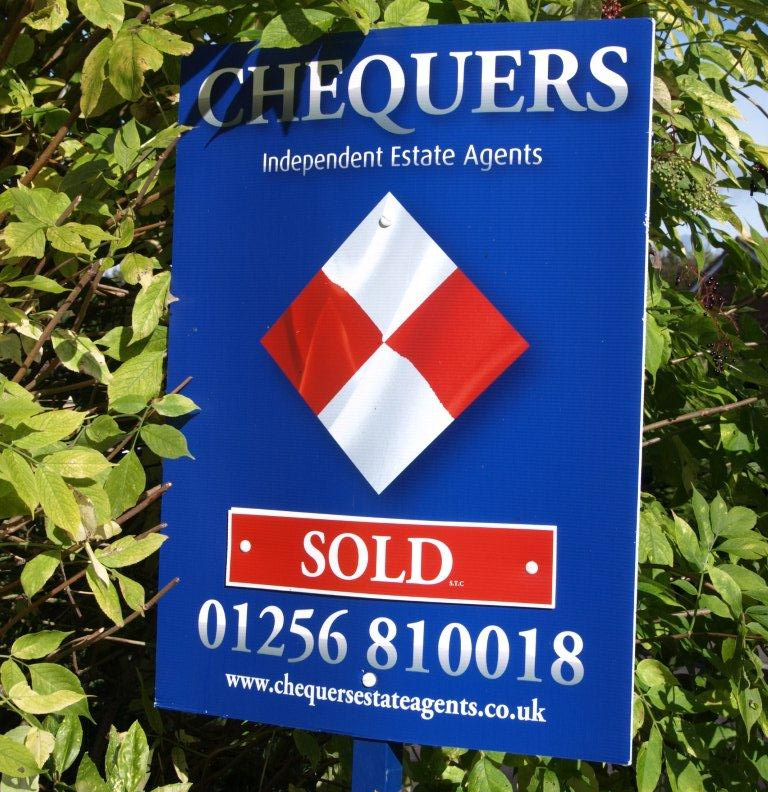 For sale sign outside property